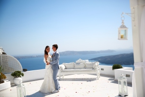 This is my husband and I together on Santorini (Greece) minutes after we were married! Isn’t that a spectacular view!?! Yes! :)